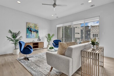Living room with hardwood floors, recessed lights