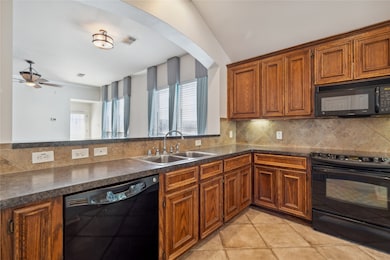 The kitchen offers abundant cabinetry for ample st