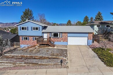Split level home featuring brick siding, driveway,