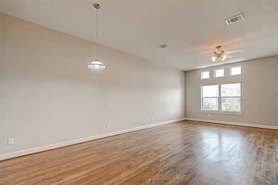 Another view of the living room with lots of windo