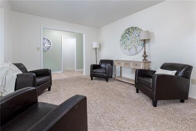 The tiled entry leads to bedrooms on the left and 
