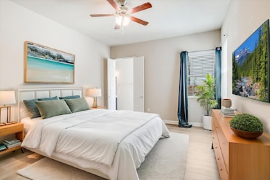 Bedroom featuring light wood-style flooring and c