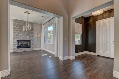 Entrance foyer featuring dark wood-type flooring,