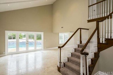 Vaulted living room with French door pool patio ac