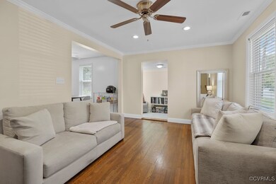 Living room featuring dark wood finished floors, a