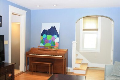 Living room with stairs to 2nd floor