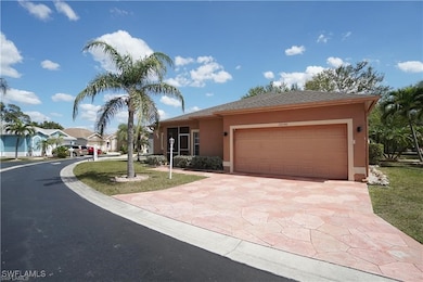 View of front of home with stucco siding, driveway