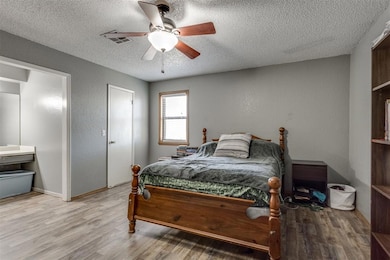 Primary bedroom is large and can hold lots of furn