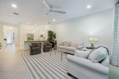 Living area featuring light tile patterned floors,