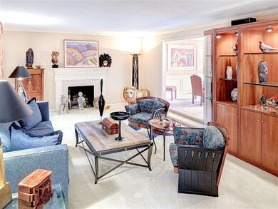 Living and dining rooms. The fireplace is gas logs