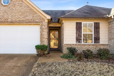 View of exterior entry featuring a garage