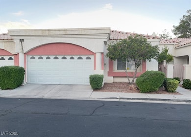View of front of home with driveway, an attached g