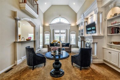 Commanding great room with a two-story ceiling ope