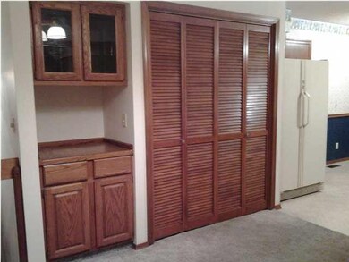 Opposite the sliding glass doors is the Built-In H