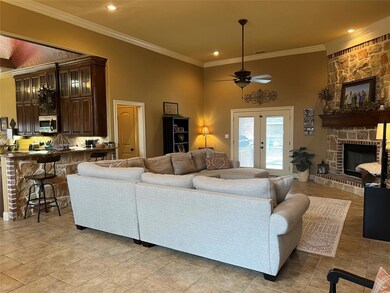 Living room with light tile flooring, french doors