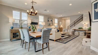 Dining area with stairway, light wood-type floorin