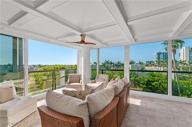 Sunroom / solarium featuring ceiling fan, outdoor