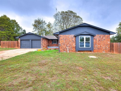 Ranch-style home with brick siding, concrete driveway, and a garage