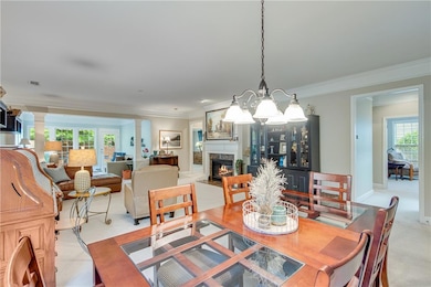 Dining area featuring a chandelier, a premium fire
