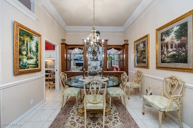 Dining space with an inviting chandelier, light ti