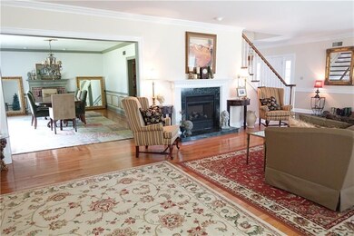 Spacious Formal Living Room with hardwood flooring