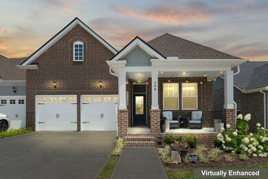 The exterior is welcoming with its neatly manicured lawn and a charming front porch.