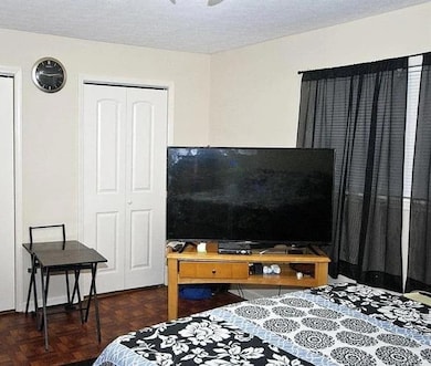 Bedroom featuring a textured ceiling