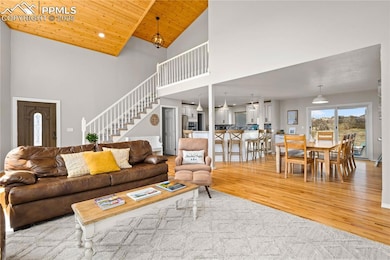 Open main level floor plan features hard wood flooring and walks out from dining area to the incredible backyard space.