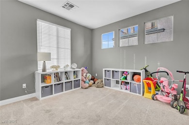 Playroom featuring carpet and baseboards