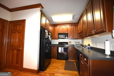 Roomy kitchen with solid surface countertops