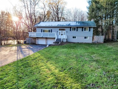 Front of House with Driveway and Pond to the left 