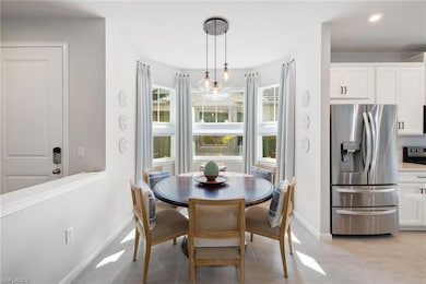 Dining room featuring baseboards, recessed lighting, and light tile patterned flooring