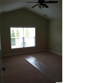 master bedroom with vaulted ceiling
