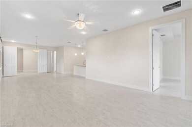 Unfurnished room featuring ceiling fan, baseboards