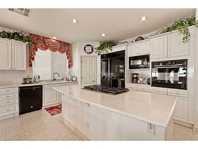 Property Photo. Kitchen features breakfast bar isl