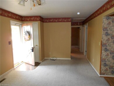 This photo shows living room, hallway to full bath