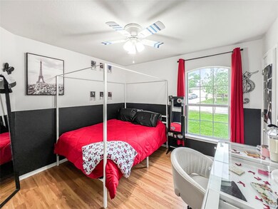 Bedroom featuring wood finished floors and a ceil