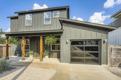 View of front of property with board and batten s