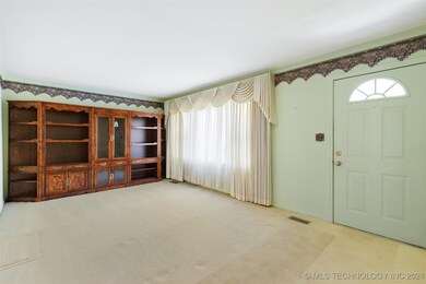 Spacious living room to greet guests.