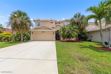 View of front of house with a garage, a front yard