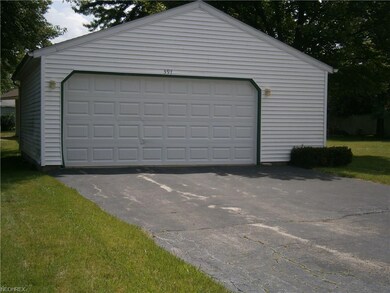 This 2 1/2 car garage offers lots of additional st