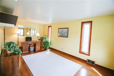 Living room with hardwood floor, could be used as 