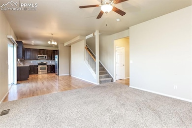 Unfurnished living room featuring visible vents, b