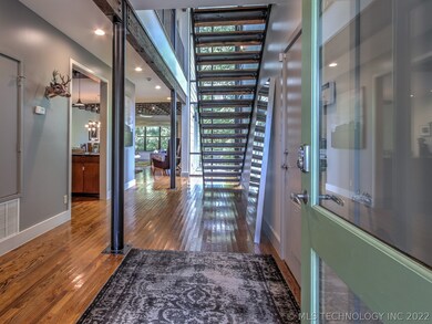 Gleaming hardwood floors greet guests from the fro