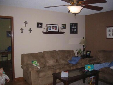 Large living room with nice laminate flooring through out home