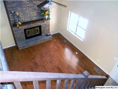 Stairway overlooking beautiful wood flooring