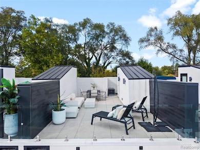 Deck featuring a shed, a fenced backyard, a patio area, and outdoor dining area