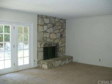 Living Room Flagstaff rock fireplace French doors leading to back yard