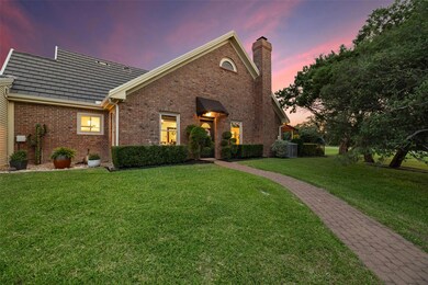 View of front of property with a chimney, brick s