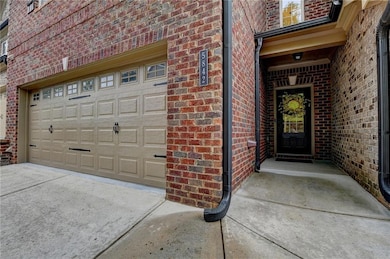 Entrance to property with brick siding and concret